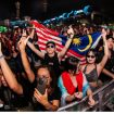 Penonton DWP 2024 membawa bendera Malaysia. Sebanyak 18 oknum anggota Polri memeras puluhan penonton asal Malaysia hingga Rp2,5 miliar. Polri didesak jerat para oknum dengan delik pidana. (Indonesiawatch.id/Dok. DWP)